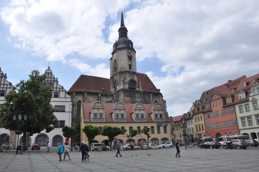 The St Wenzel clock tower casts its shadow on the Naumburg main square