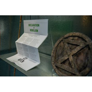 The Extinction Rebellion's list of demands and press with their logo exhibited at the V&A