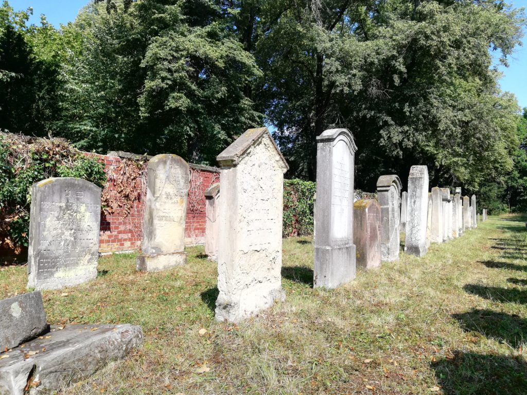 The image shows a view of the Jewish cemetery