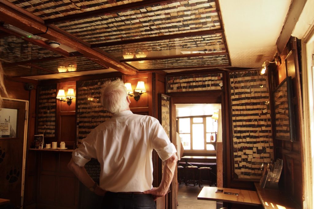 A man admires the Bear Inn’s collection of antique neckties