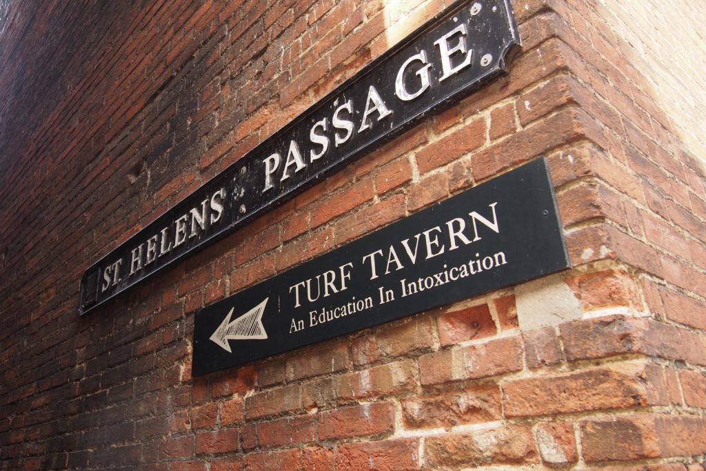 A sign points to the Turf Tavern