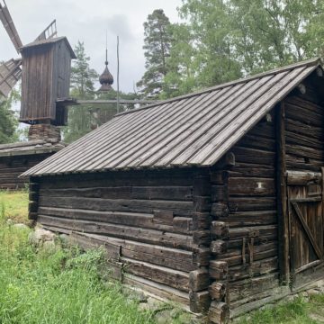 A wooden house and a wooden windmill