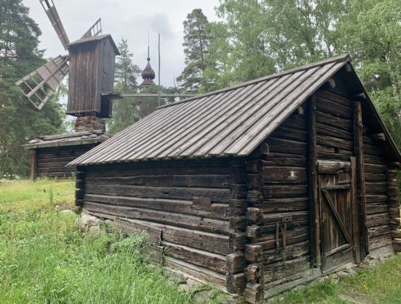 Seurasaari Open-air Museum / Photo: Lindsay Taylor, 2022 A wooden house and a wooden windmill