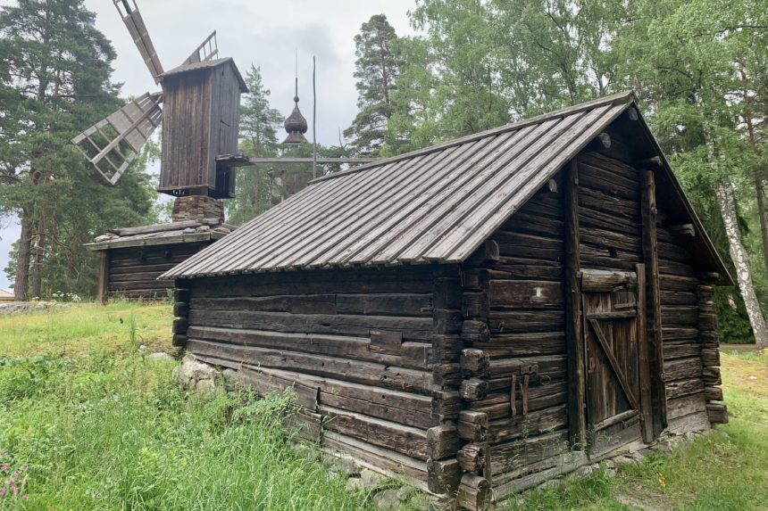 A wooden house and a wooden windmill