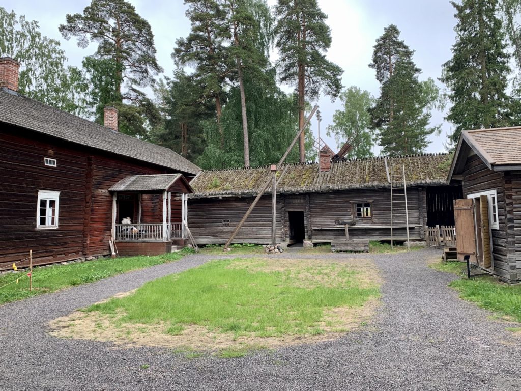 A courtyard with wooden houses