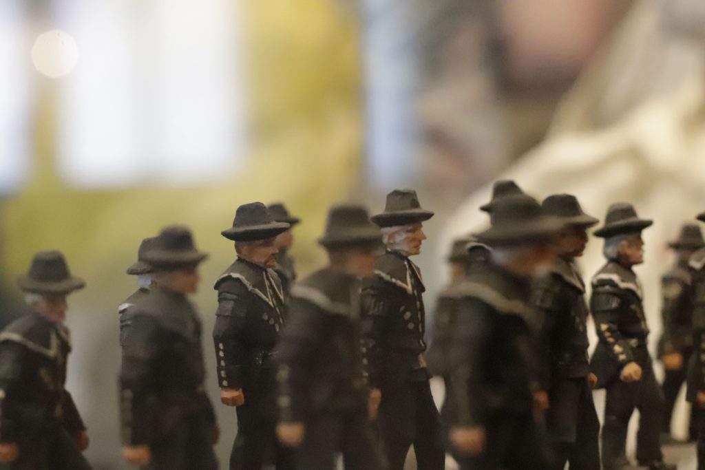 Wood dolls portraying a miners parade